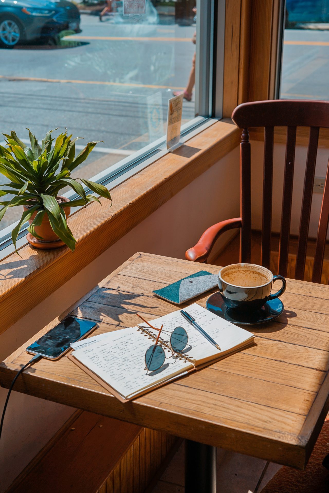 Image of a cozy cafe table by a window.